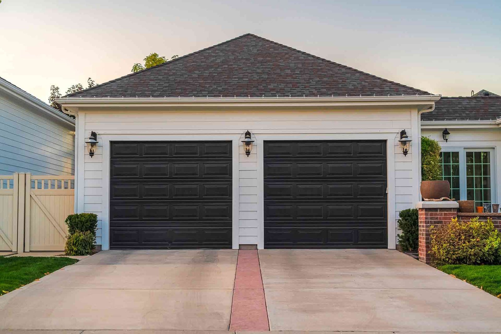 "Overhead garage door repair service in Dublin, Ohio, featuring technicians fixing a residential garage door to ensure smooth operation."