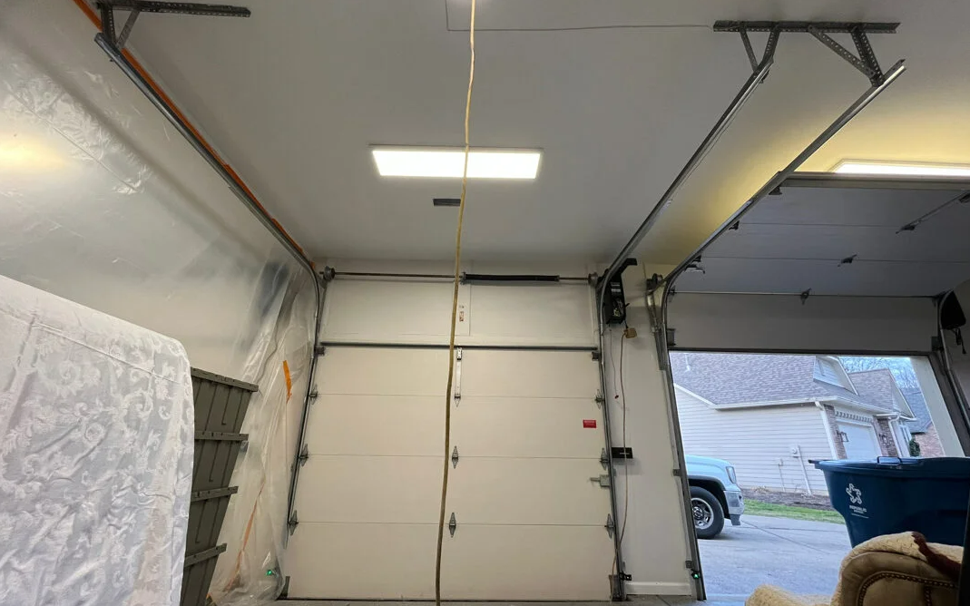 Professional garage door repair services in Dublin, Ohio - skilled technicians fixing overhead garage doors